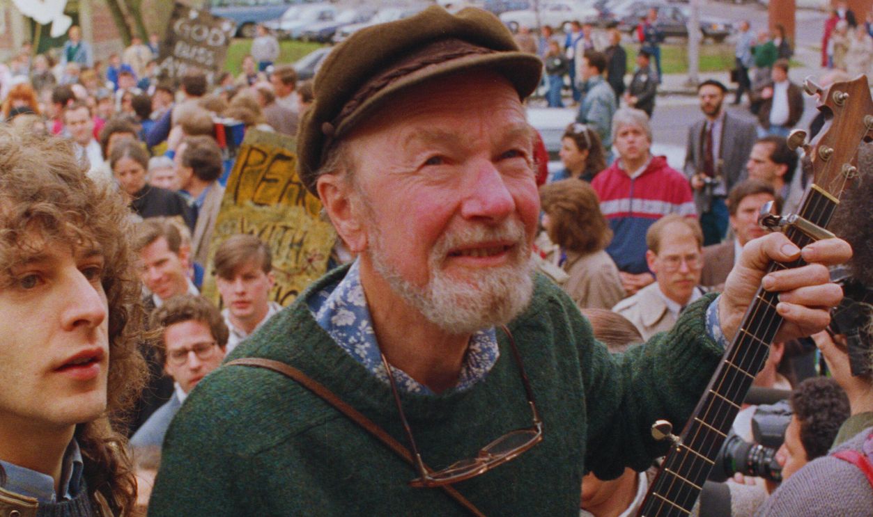 Gettyimages - 514866278, Pete Seeger Leads Procession Folk singer Pete Seeger leads a crowd of mourners from the childhood home of political activist Abbie Hoffman to Temple Emmanuel for a traditional Jewish memorial service. Hoffman was recently found dead in his Pennsylvania home.