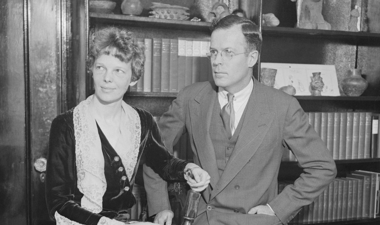 Mr. and Mrs.George Palmer Putnam, photographed in their apartment at the Hotel Wyndham, 42 West 58th Street, New York City. This is the first photo of them together since their marriage. Mrs. Putnam is the former Amelia Earhart of international fame, being the first woman to fly the Atlantic.