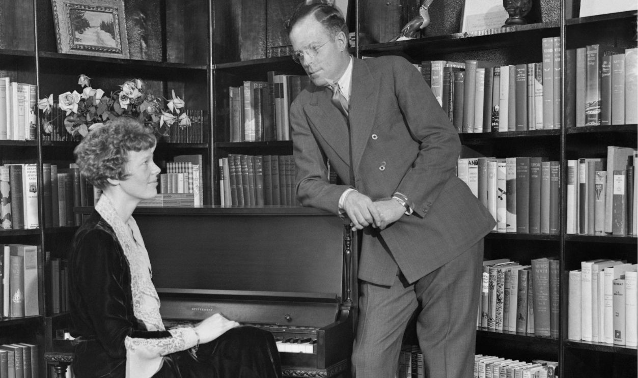 After a honeymoon of but two days, Mr. and Mrs. George Palmer Putnam returned to work. Mrs. Putnam is the former Amelia Earhart, famous transatlantic flier. Putnam is a publisher and Arctic explorer of note. Mrs. Putnam resumed her duties as an officer of a flying corporation, still continuing to use her maiden name. Here is the couple in Putnam's New York office.