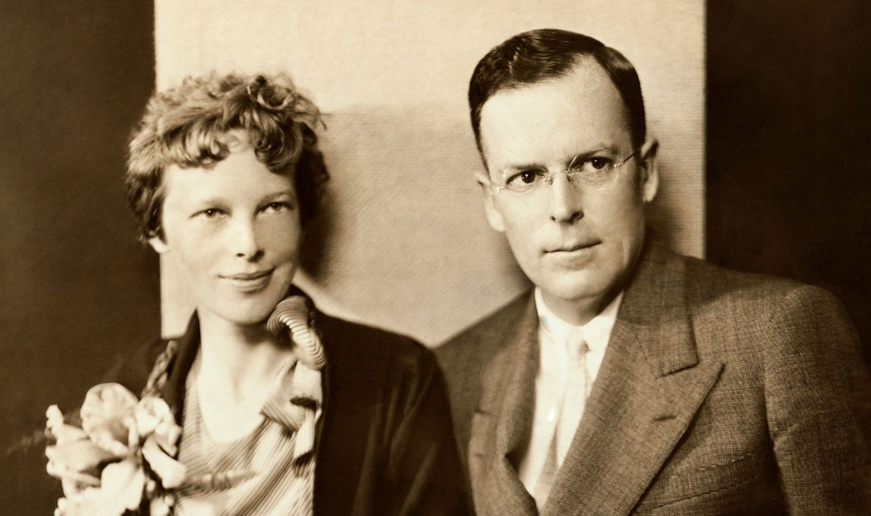 Amelia Earhart and her husband, George Palmer Putnam, are shown seated.