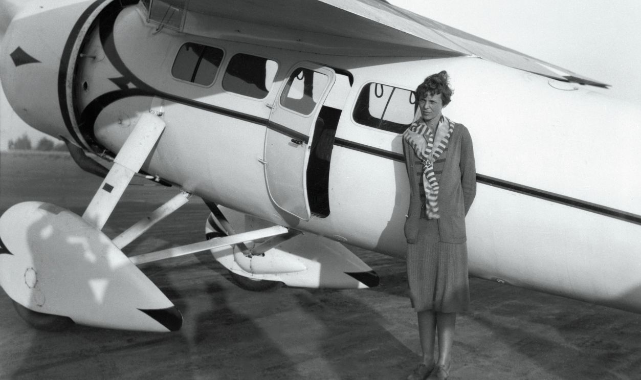 Amelia Earhart Sets New Woman's Record. Miss Amelia Earhart, first woman to fly a solo plane, set a new unofficial speed record for flyers, by putting her Lockheed plane at 184 and 17/100 miles per hour, the record was 156 miles an hour. This photo is as she prepared for the flight.
