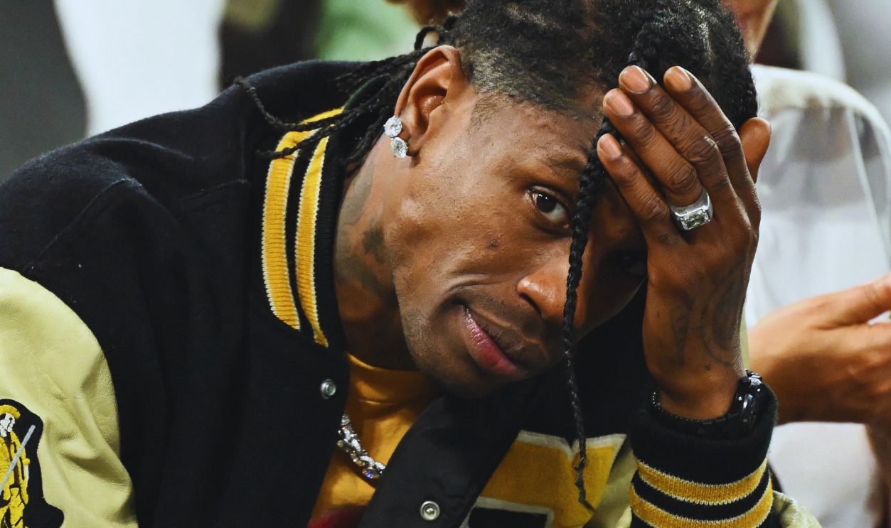 Gettyimages - 2165453437, TOPSHOT-OLY-PARIS-2024-FRA-VIP-US-CRIME TOPSHOT - US rap artist Travis Scott gestures as he attends the men's semi-final basketball match between France and Germany during the Paris 2024 Olympic Games at The Bercy Arena in Paris on August 8, 2024. Paris prosecutor's office announced on August 9, 2024, that US rap artist Travis Scott has been arrested in Paris after a fight at The Georges V Hotel in the French capital.