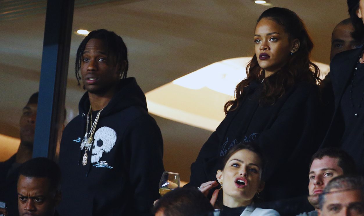 Gettyimages - 491341728, Paris Saint-Germain v Olympique de Marseille - Ligue 1 PARIS, FRANCE - OCTOBER 4: Rihanna and Travis Scott (left) attend the French Ligue 1 match between Paris Saint-Germain FC (PSG) and Olympique de Marseille at Parc des Princes stadium on October 4, 2015 in Paris, France.