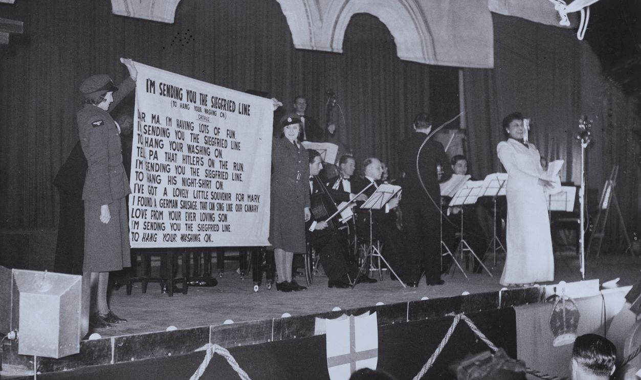 Gettyimages - 612288330, Scene at an RAF Variety concert at Adelaide Hall showing a singer performing the song