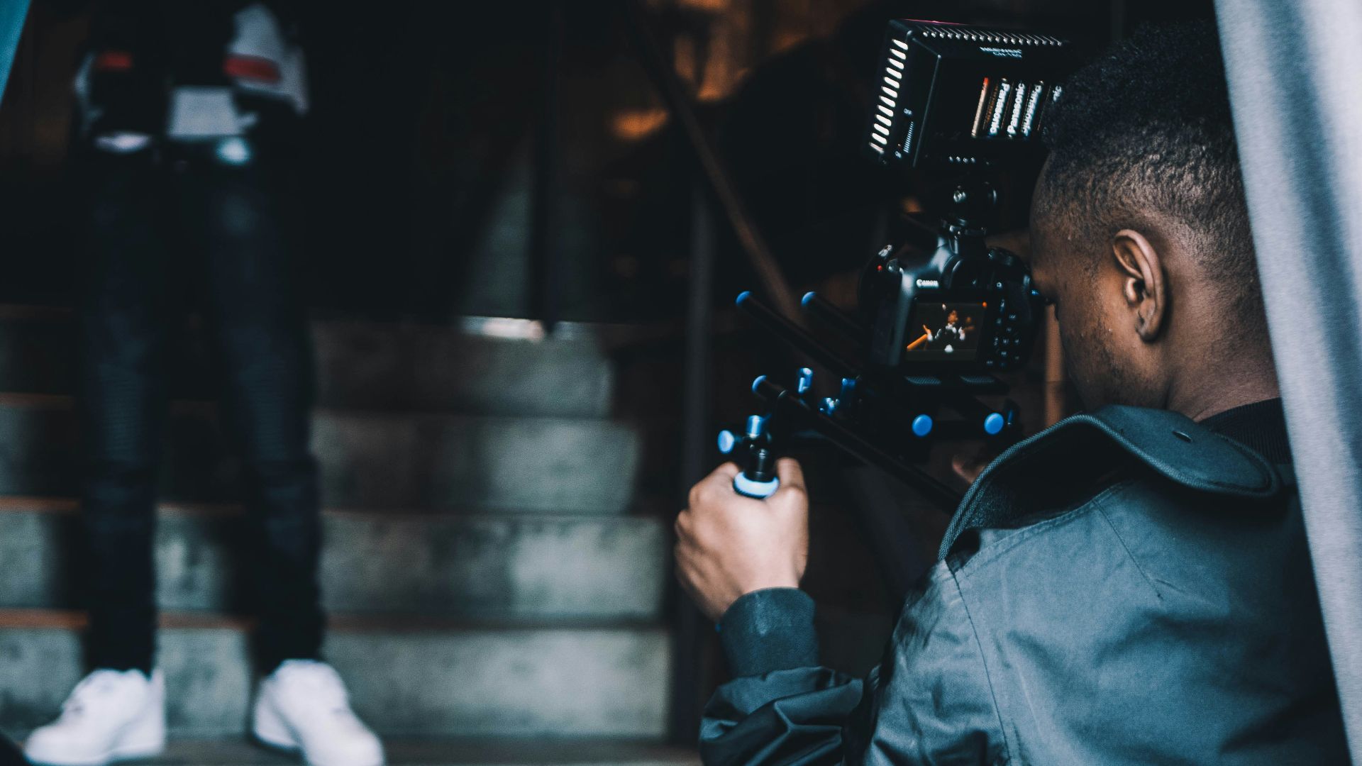 man taking photo of another man