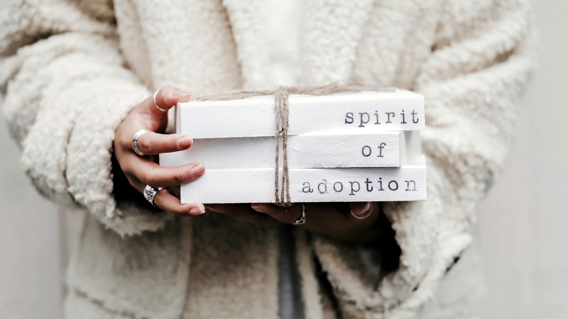 woman holding spirit of adoption blocks
