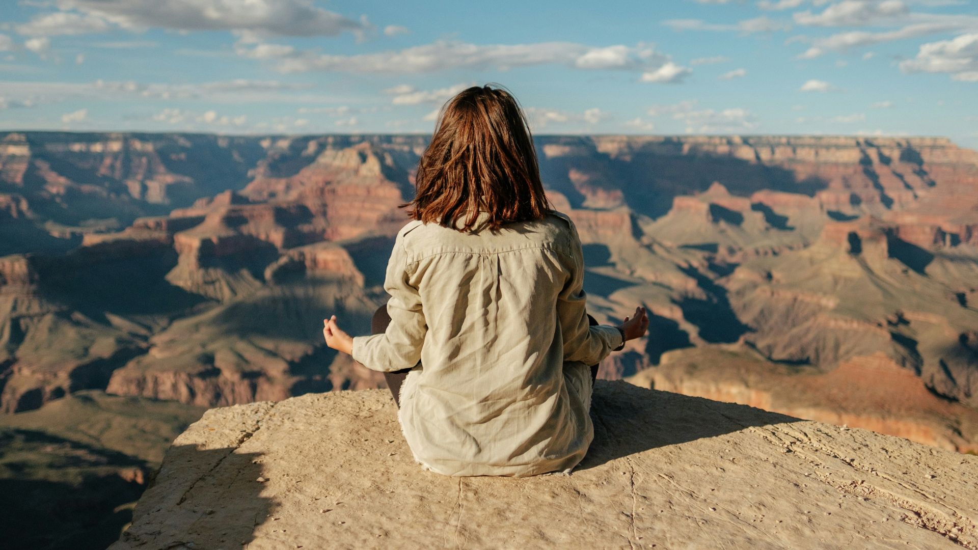 woman sitting on hill