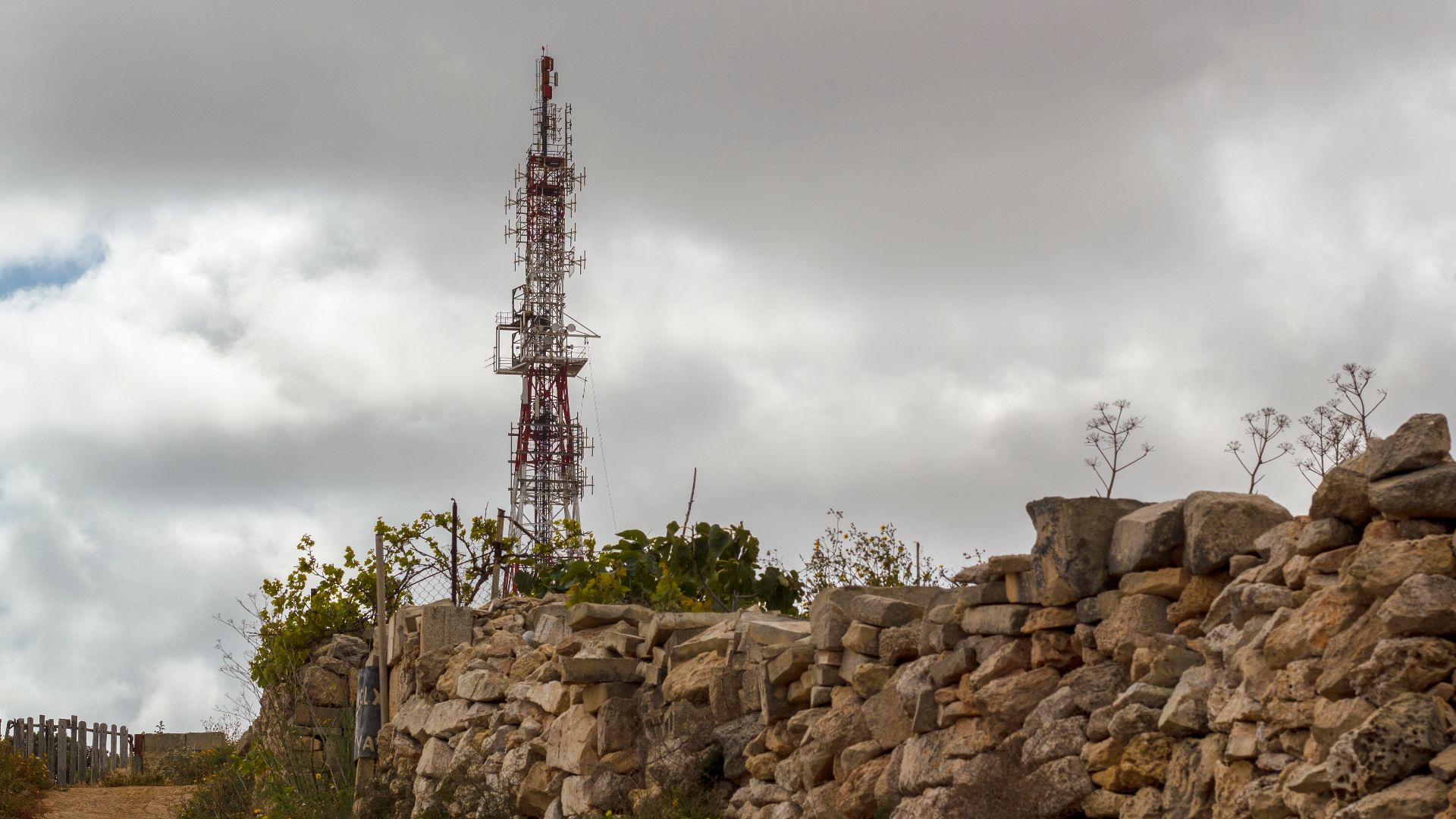 Rubble wall with Transmission Pole at the background.jpg