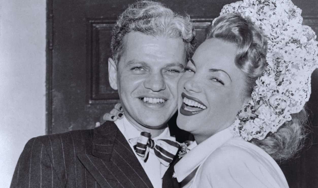 Gettyimages - 514958078, Carmen Miranda and Husband David Alfred Sebastian (Original Caption) Carmen Miranda, the South American dancing dynamo, and David Alfred Sebastian, film producer, were married at the Church of the Good Shepherd (by Monsignor Patrick J. Concannon). Carmen's sister, Mrs. Aurora Richard, was Matron of Honor and the groom's brother, M.E. Sebastian, was best man. The couple announced they will honeymoon in San Francisco.