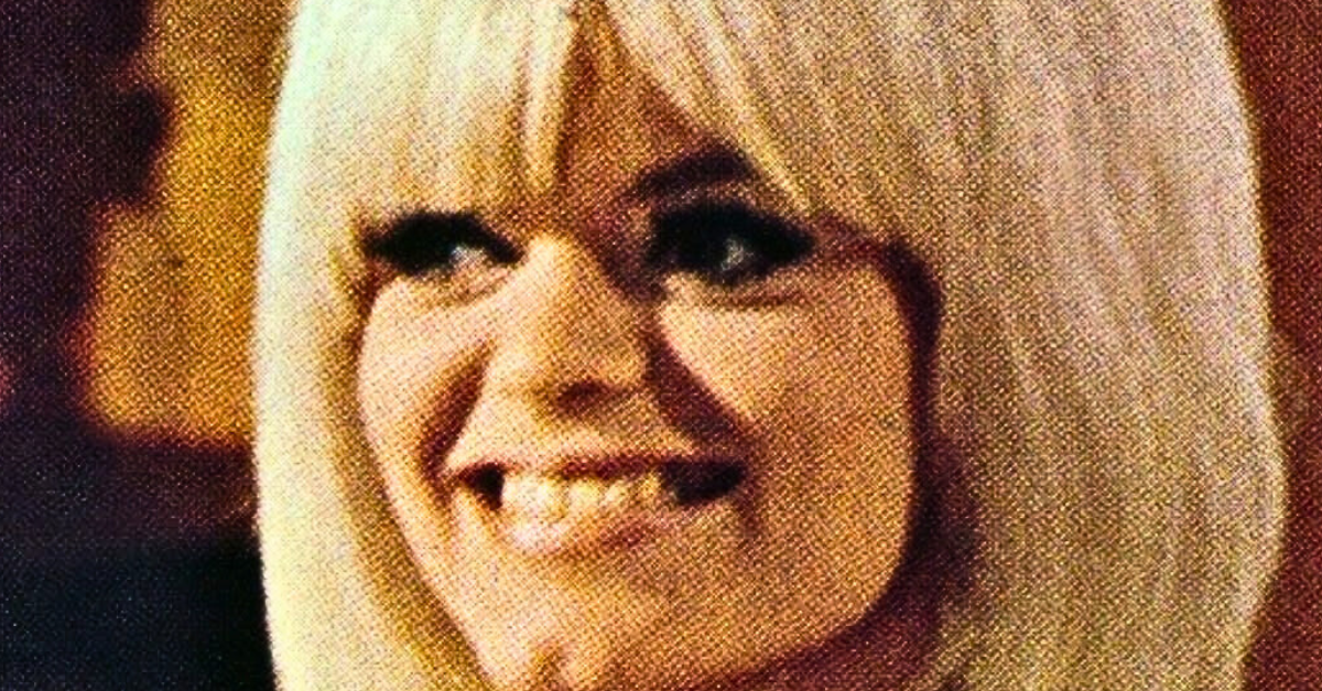 Carol Wayne smiling and looking away from the camera