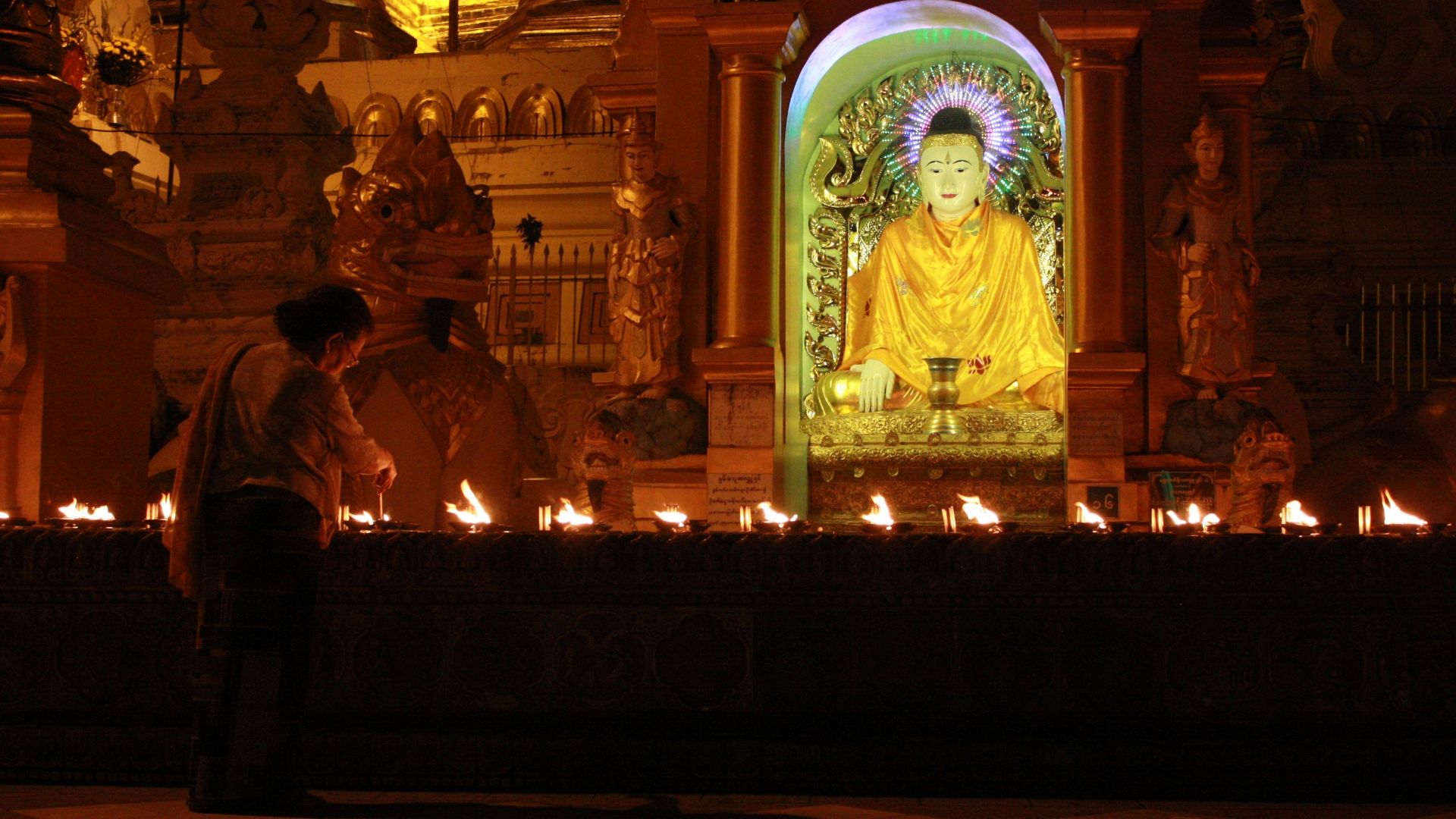 gold buddha statue in front of gold buddha statue