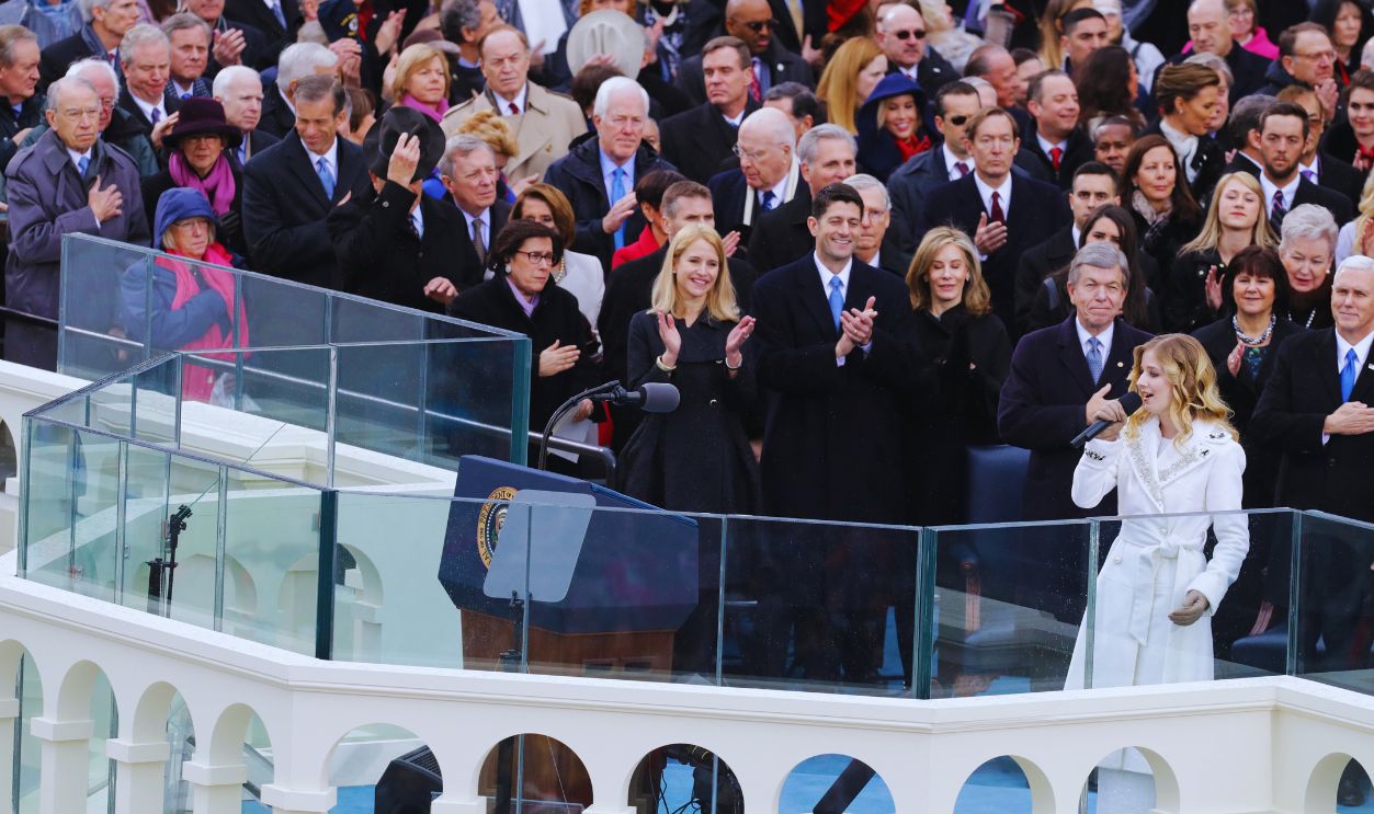 Gettyimages - 632198236, Donald Trump Is Sworn In As 45th President Of The United States WASHINGTON, DC - JANUARY 20: (R-L) Jackie Evancho performs the National Anthem as Speaker of the House Rep. Paul Ryan (R-WI) and his wife Janna Ryan clap on the West Front of the U.S. Capitol on January 20, 2017 in Washington, DC. In today's inauguration ceremony Donald J. Trump becomes the 45th president of the United States.