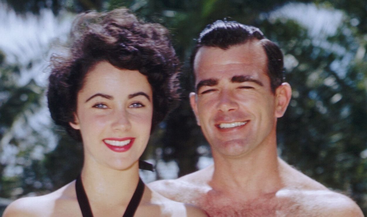 Gettyimages - 514866456, Elizabeth Taylor and William D. Pawley, Jr. William D. Pawley, Jr. and his fiancee, 17-year-old Elizabeth Taylor, relaxing poolside in August 1949 at the Miami Beach home of Pawley's father, a former U.S. Ambassador to Peru and Brazil.