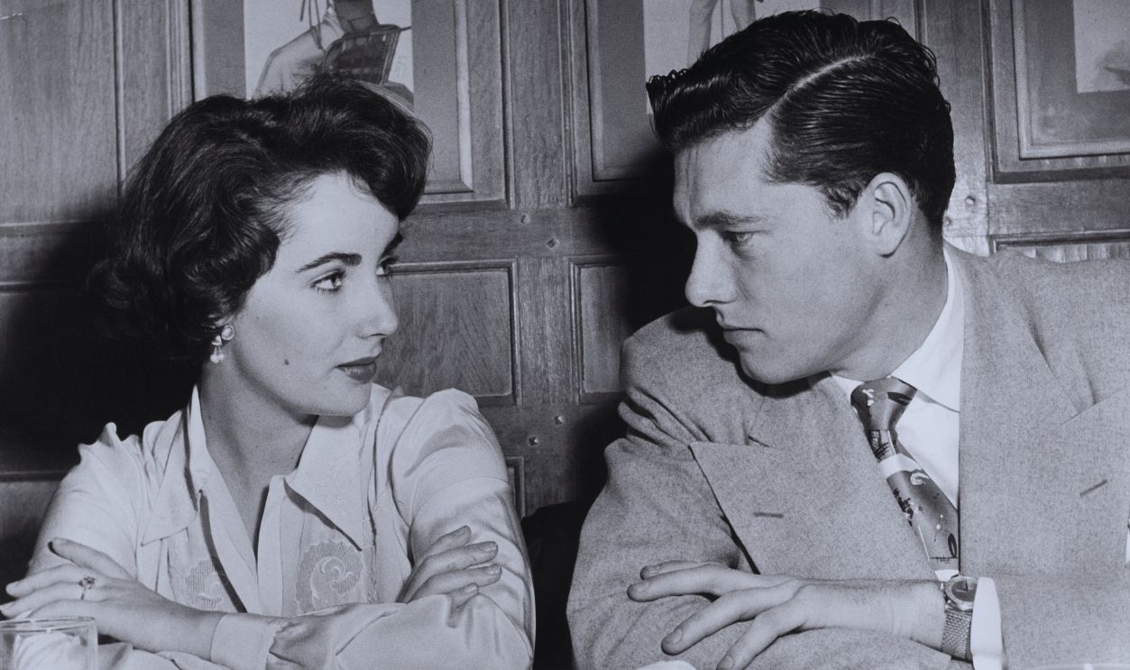 Gettyimages - 107158398, Elizabeth Taylor and her fiance in New York City NEW YORK CITY, NY - MARCH 24: Movie star Liz Taylor with her fiance Conrad N.Hilton Jr,son of the hotel tycoon Conrad Hilton on March 24, 1950 in New York City.