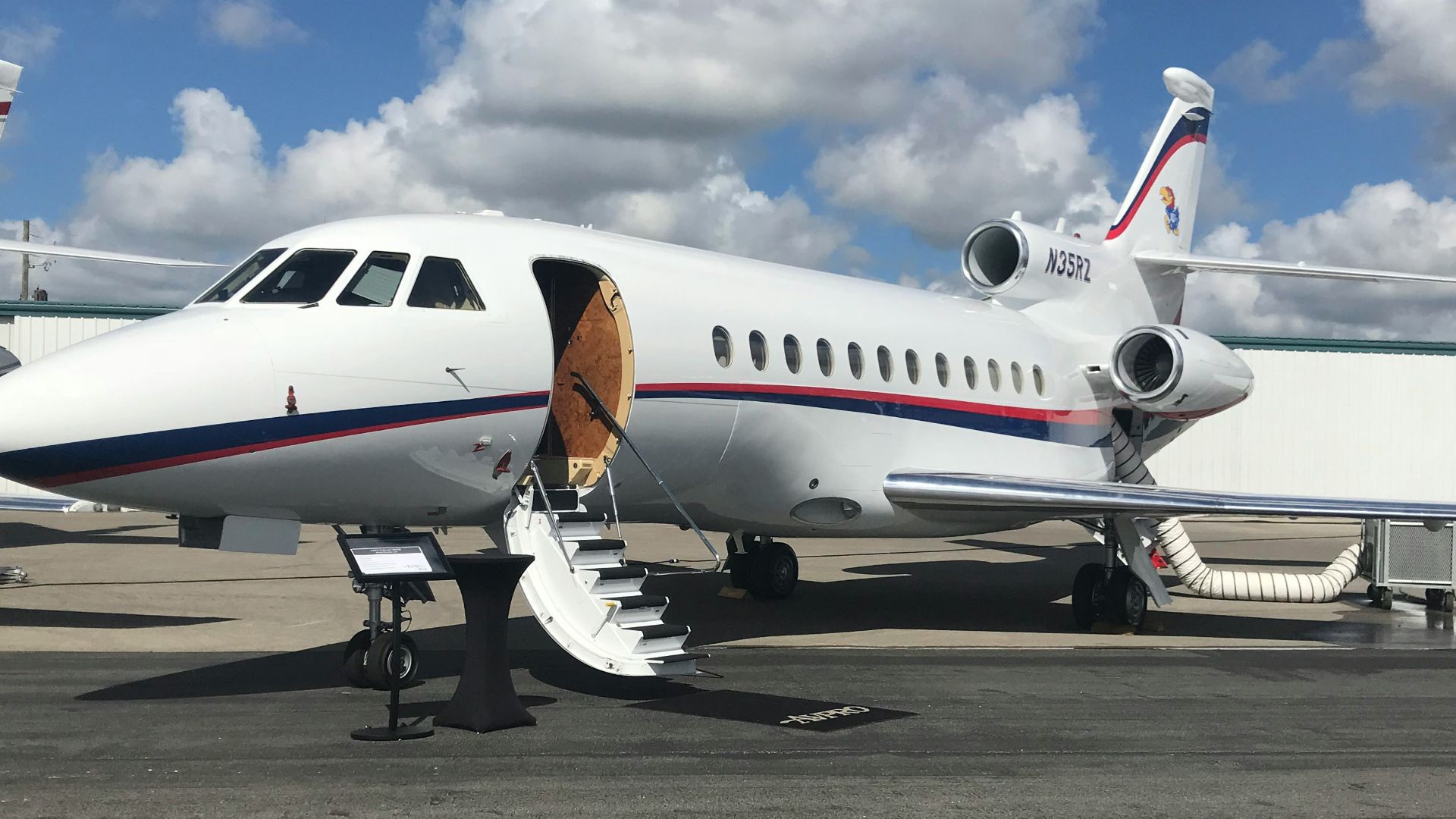 white airliner on gray pavement