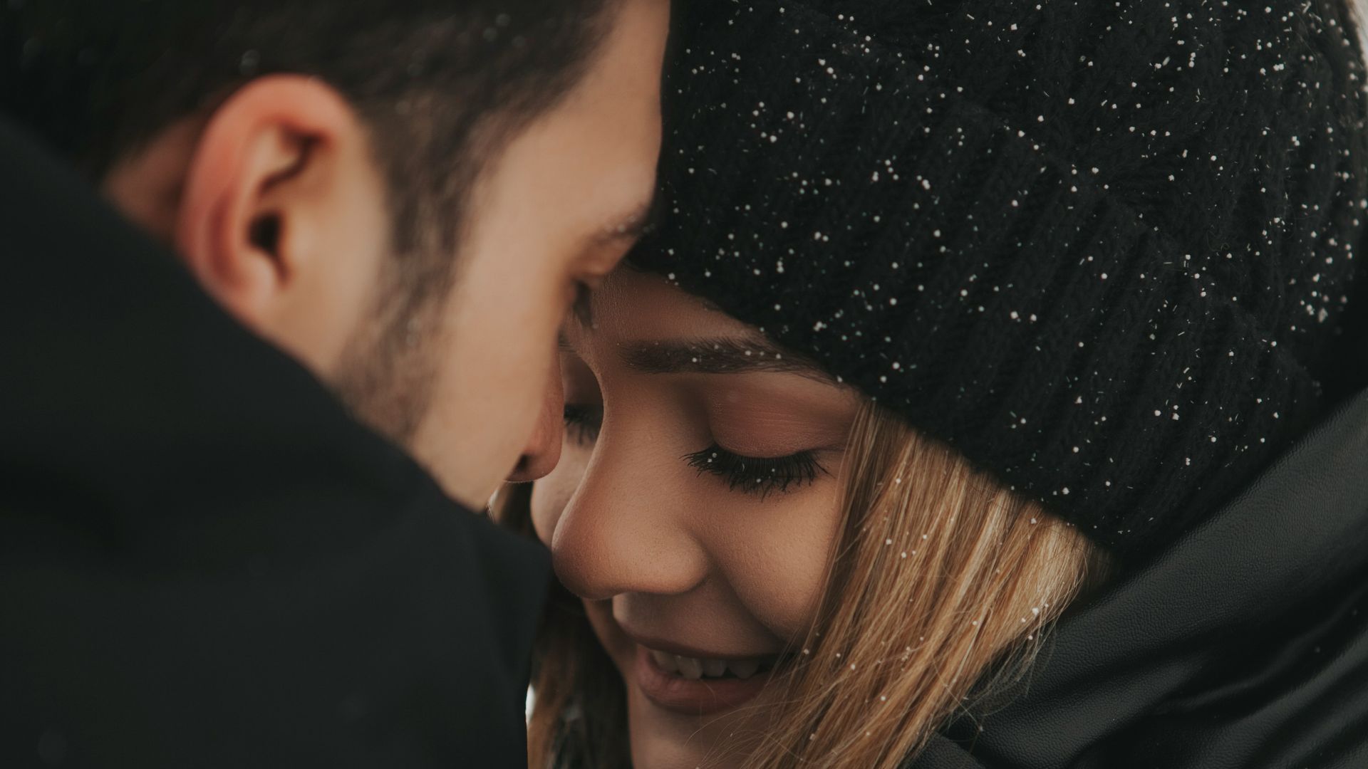 a man and a woman are smiling together