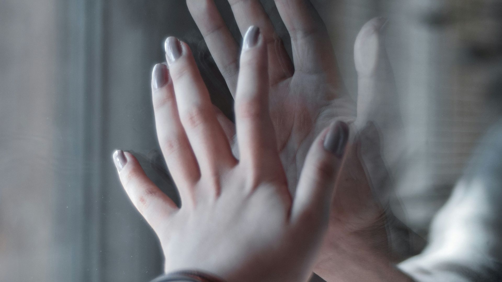 person in red and silver bracelet