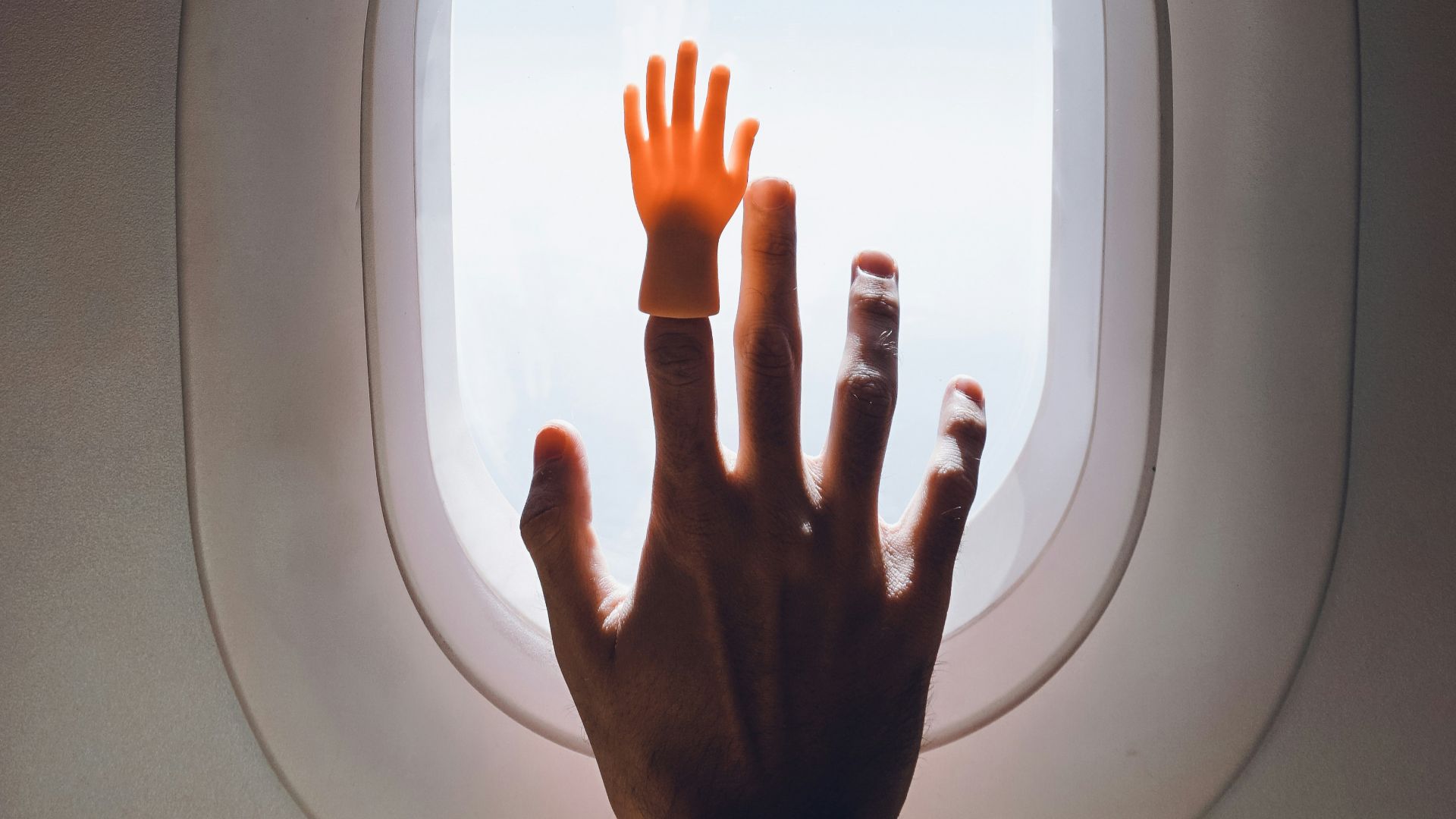 persons hand on white round frame