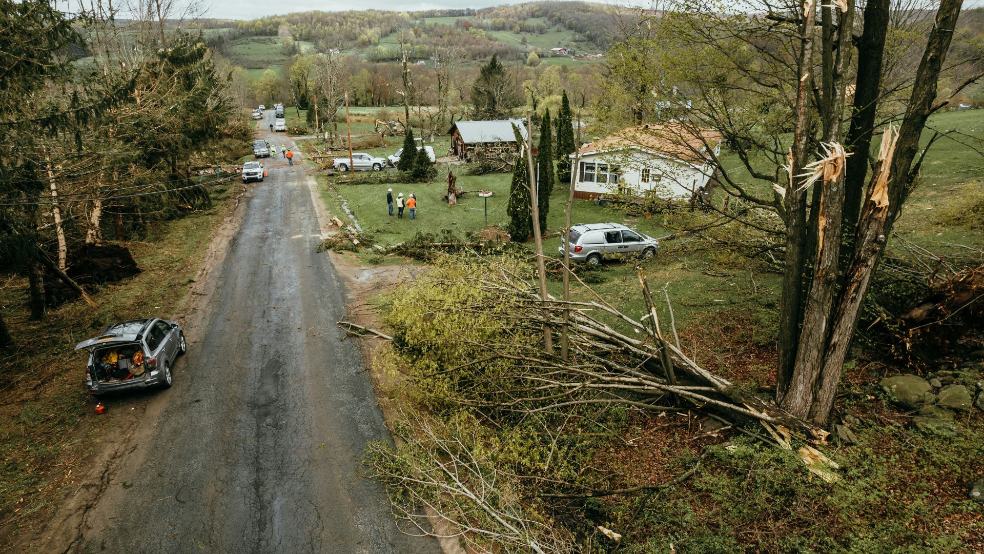 a car parked on the side of a dirt road