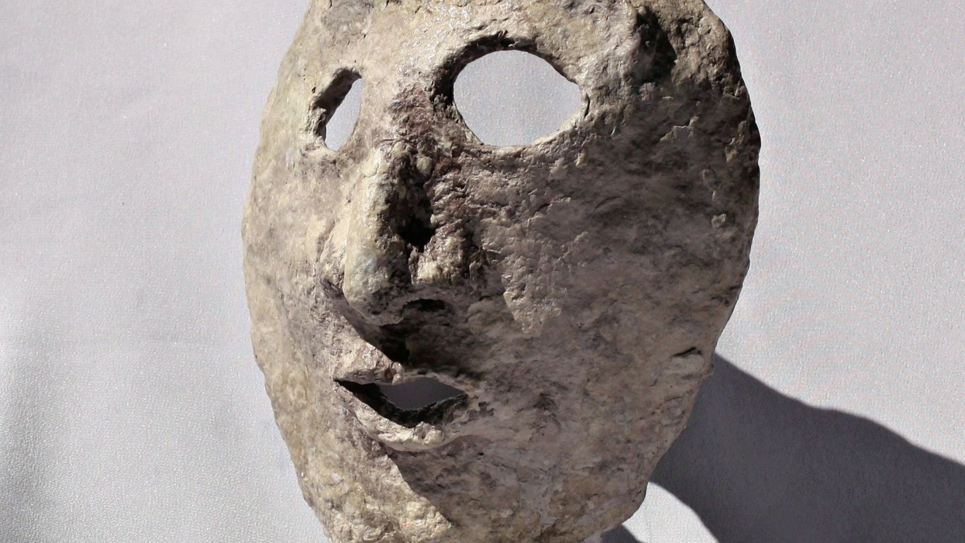 File:Paper mache mask with feet with grey background.JPG