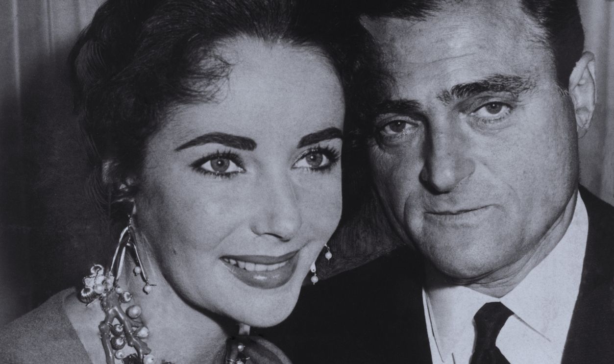 Gettyimages - 1360178245, Elizabeth Taylor and Mike Todd, 1957 Elizabeth Taylor and Mike Todd as he announces he will buy the Palace Theatre London in order to show his £2.5 million epic film Around The World In 80 Days, the film uses a process called Cinestage and requires a 47ft long curved screen for viewing, 1957