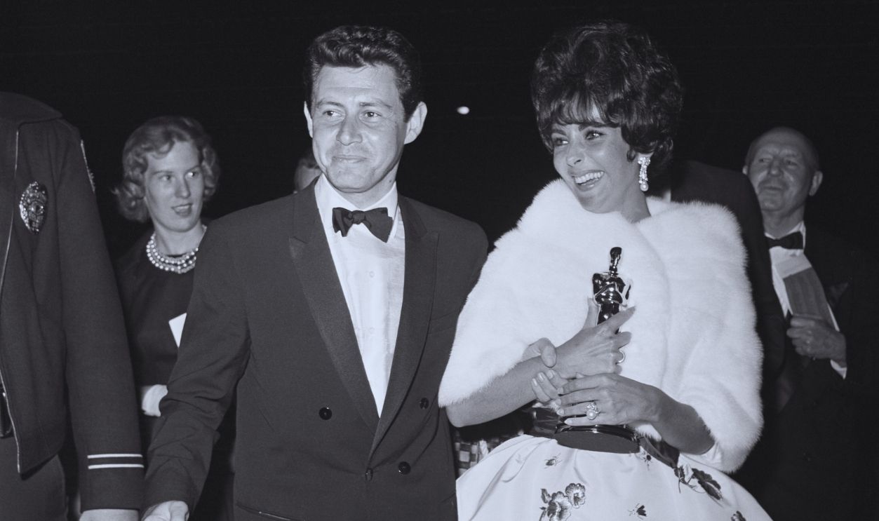 Gettyimages - 514901020, Elizabeth Taylor and Eddie Fisher in Formal Attire (Original Caption) Santa Monica, California: Elizabeth Taylor and Eddie Fisher leave the theater after Academy Awards presentations. Liz proudly walks with