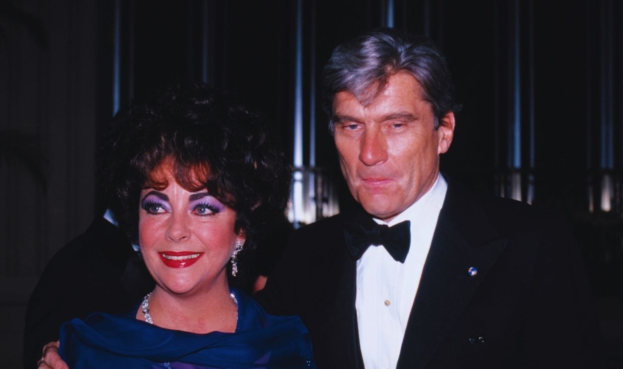 Gettyimages - 524980560, USA - Elizabeth Taylor Stars in 'The Little Foxes' in New York ELIZABETH TAYLOR with her husband SENATOR JOHN WARNER attending the The Tony Awards Party at the Waldorf Astoria Hotel in New York City