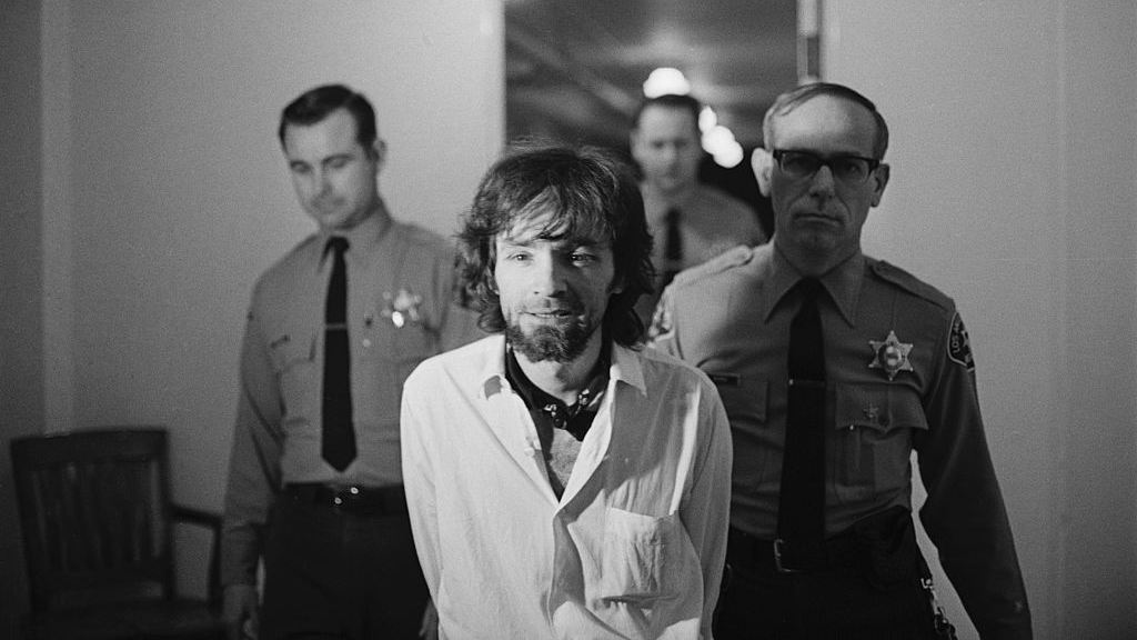 Charles Manson Being Escorted by Police