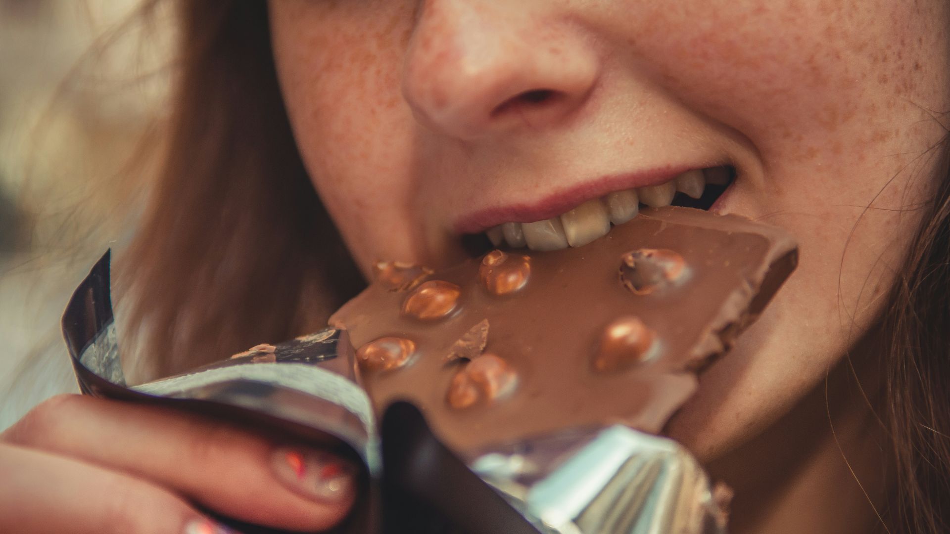 woman eating chocolate