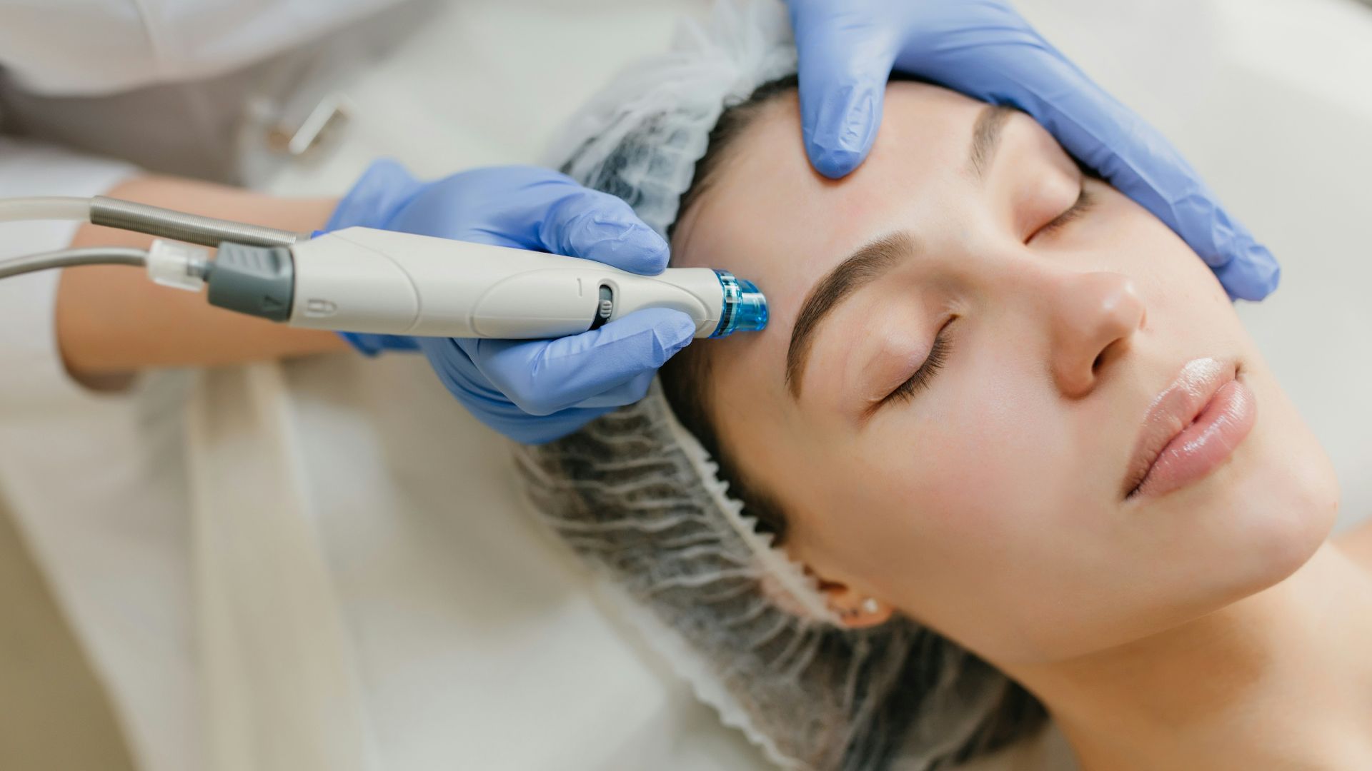a woman getting a facial peel from a doctor