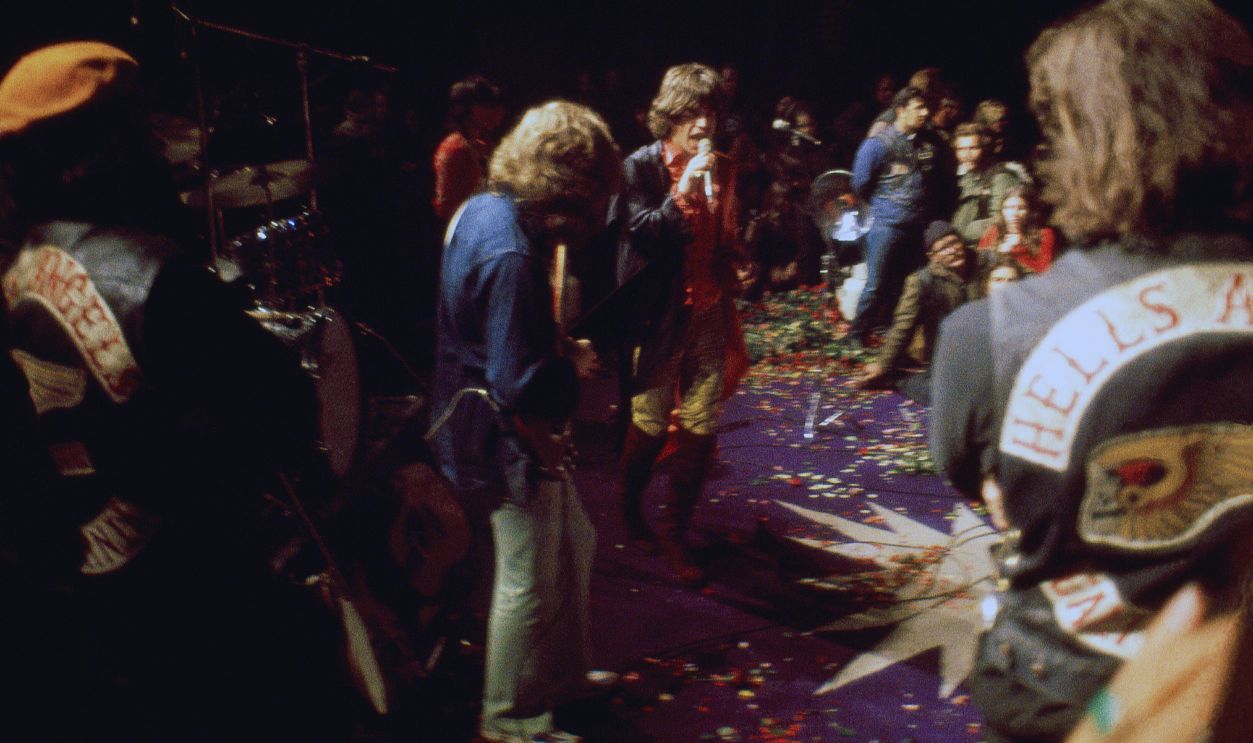 Gettyimages - 1318455240, The Rolling Stones and Hells Angels MC at Altamont TRACY, CA - DECEMBER 6: (L-R) English guitarist Mick Taylor, English singer, songwriter, actor, and film producer Mick Jagger and English guitarist, singer, and songwriter Keith Richards of the English rock band The Rolling Stones perform as Hell's Angels guard