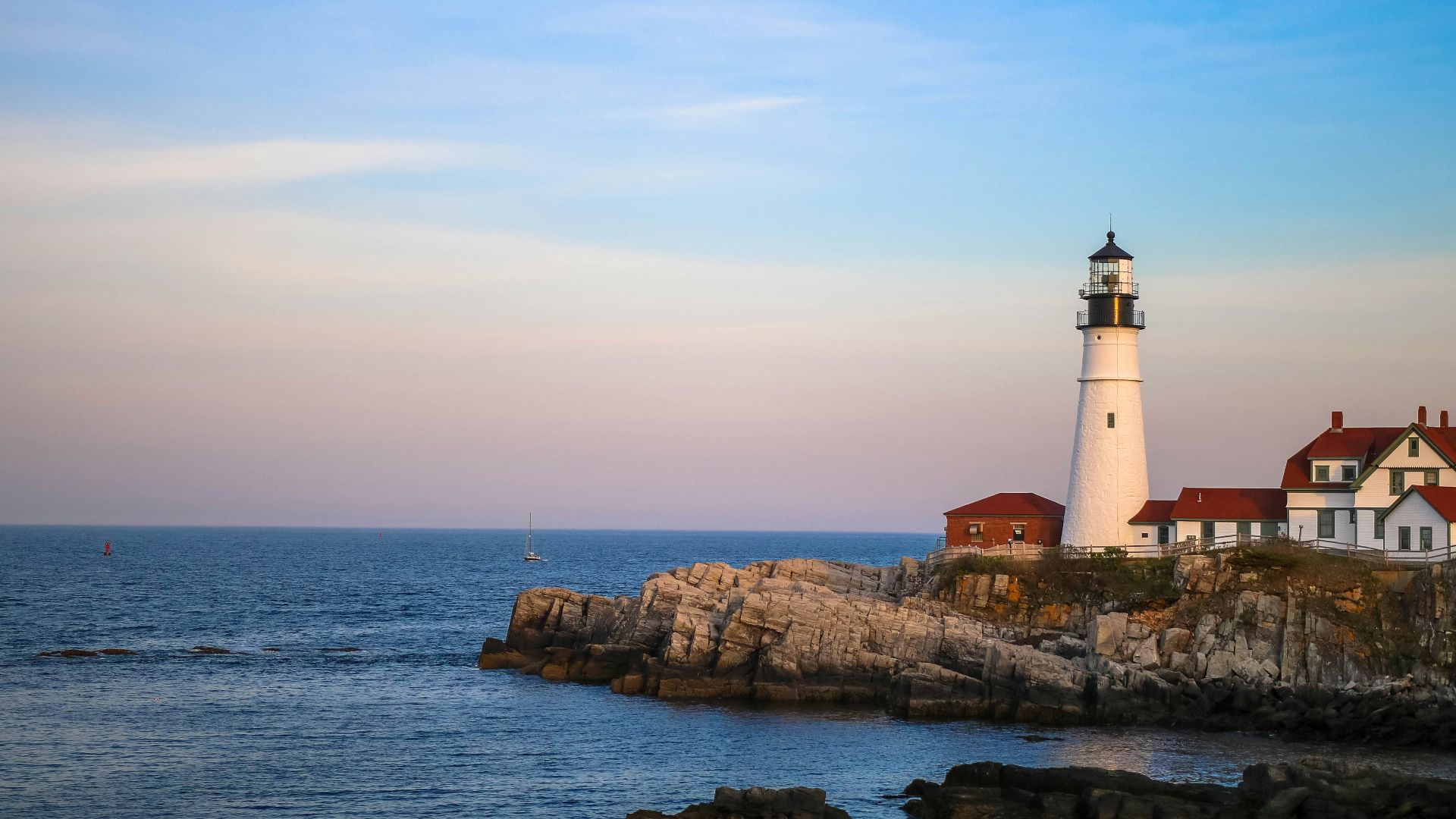 white lighthouse near body of water