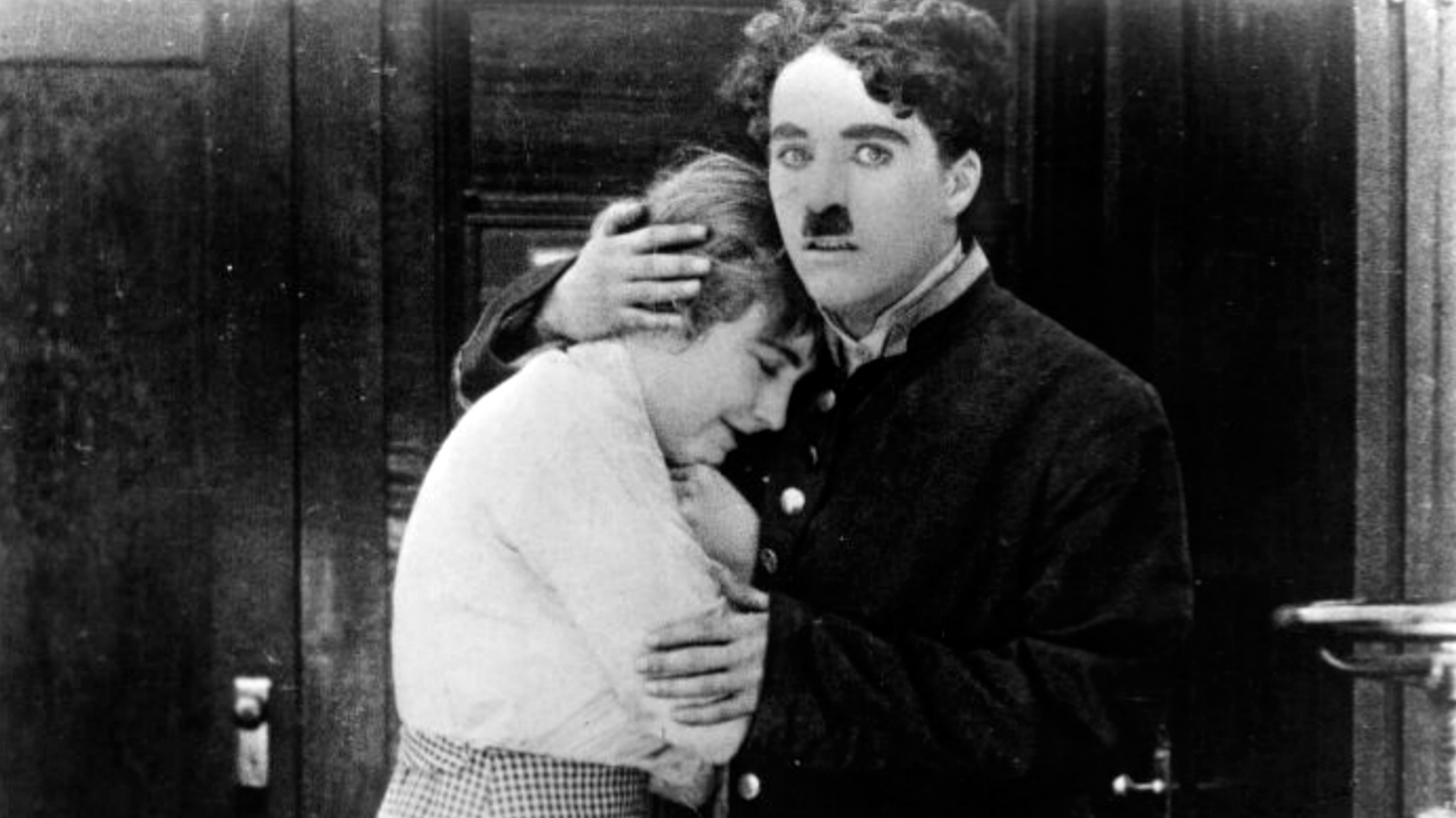 Edna Purviance And Charlie Chaplin In The Bank