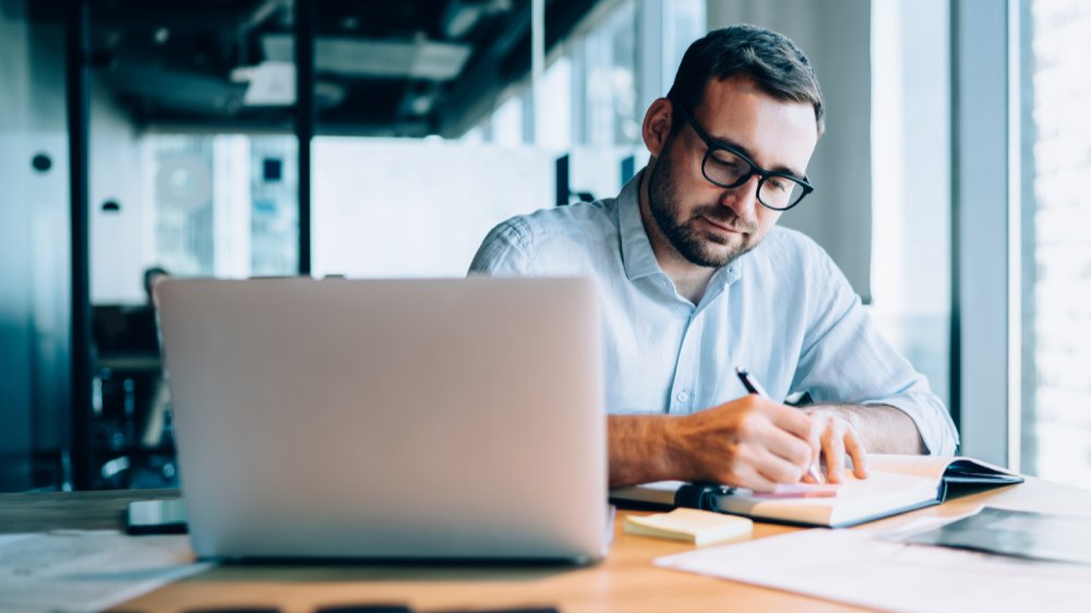 Professional expert working with information for business report