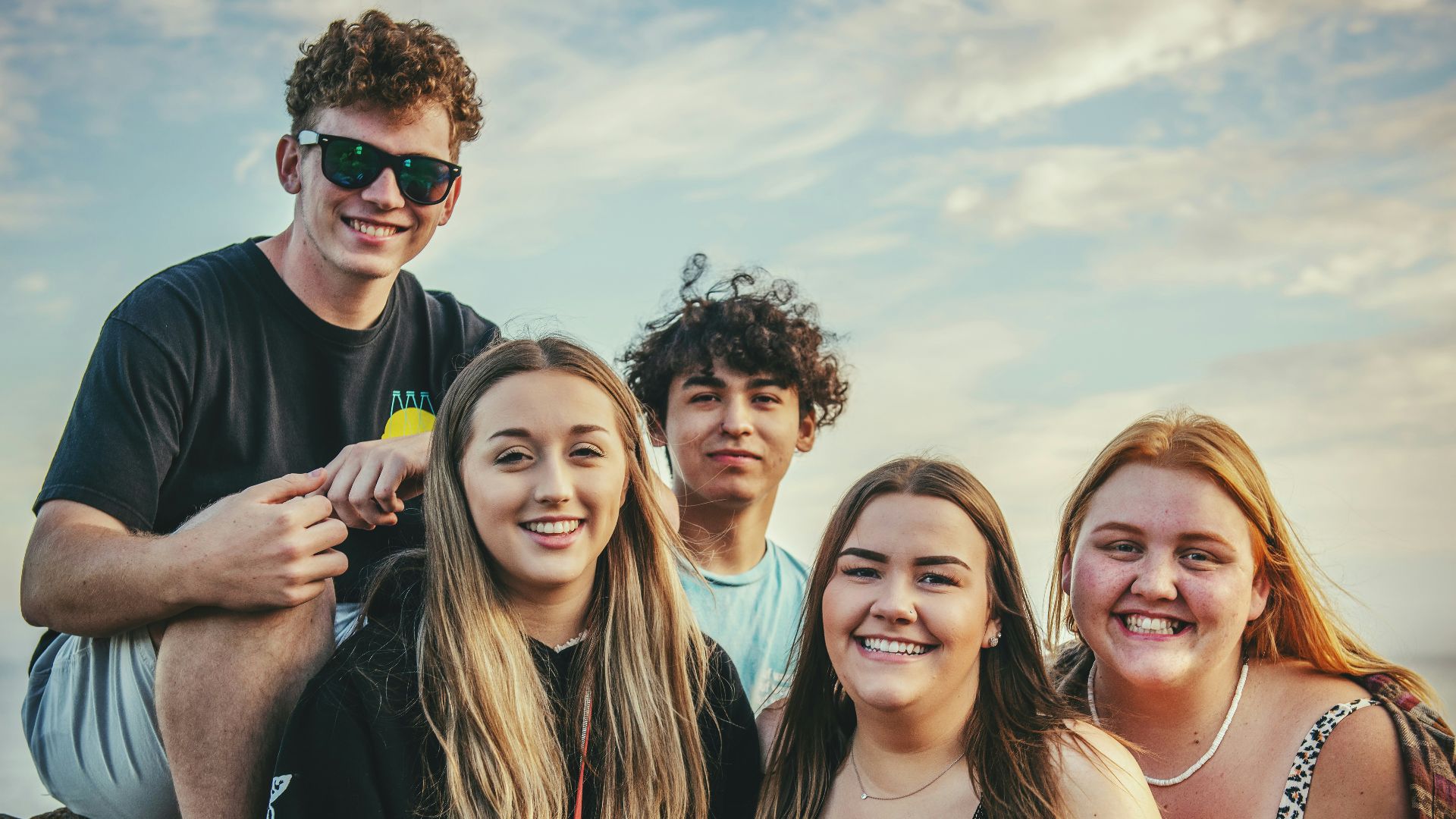 photography of five people near outdoor during daytime