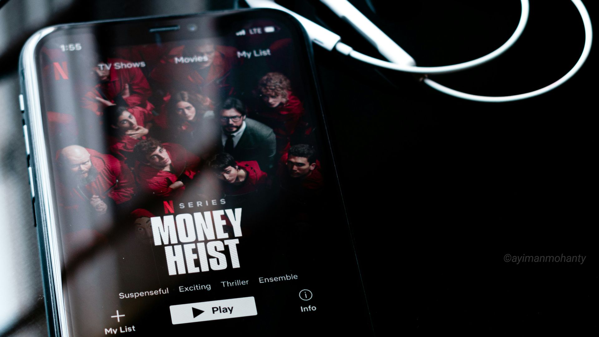 black android smartphone displaying music player