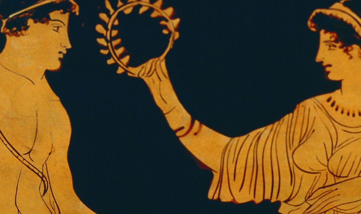   Gettyimages - 122219527, Vase, decoration depicting victory crowns an athlete with olive branch, detail UNSPECIFIED - CIRCA 1900: Greek civilization, 5th century b.C. Red-figure pottery. Detail of a vase: victory crowns an athlete with an olive branch.