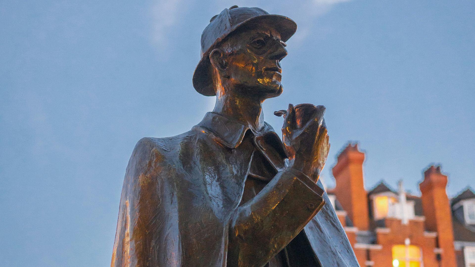 A statue of a man holding a pipe