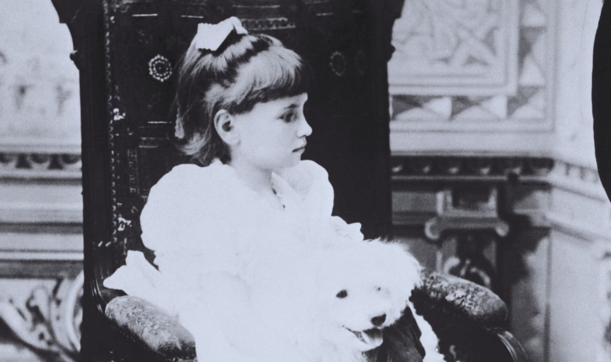 Gettyimages - 514901292, Helen Keller Holding Pet Poodle in Chair (Original Caption) Helen Keller (1880-1968), famous author and promotor of education for the blind, was born deaf and blind herself, but with the help of educator Anne Sullivan, graduated from Radcliffe College and wrote several books. Her life was celebrated in the Pulitzer Prize-winning Broadway play The Miracle Worker, in 1959.