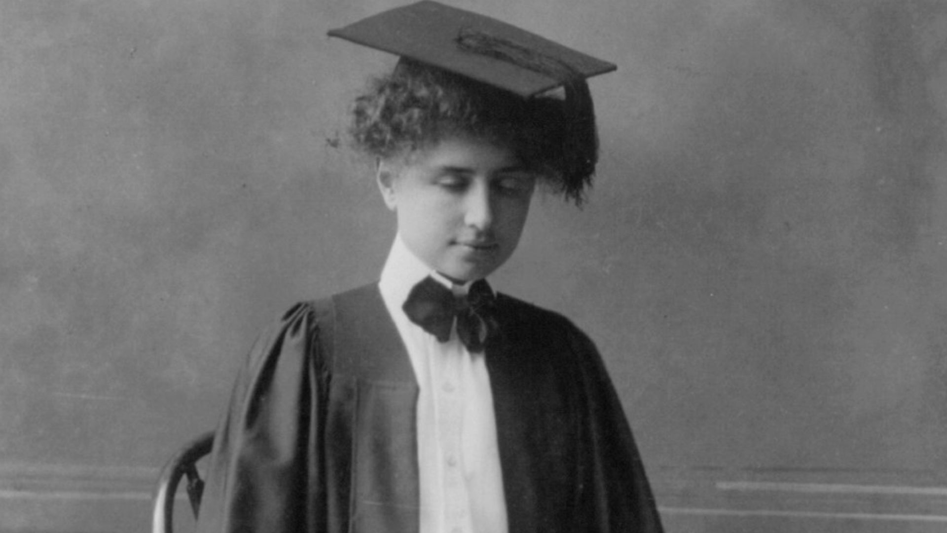 File:Helen Keller, full length portrait, seated in cap and gown LCCN2016651807.jpg