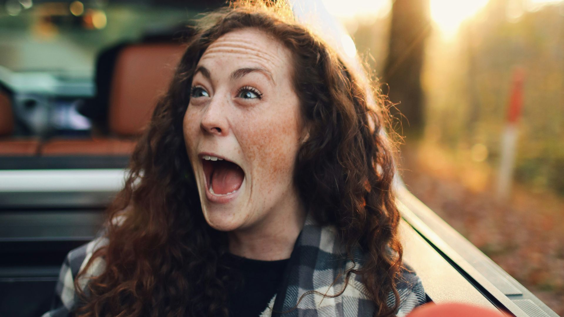 woman in black and white checkered scarf