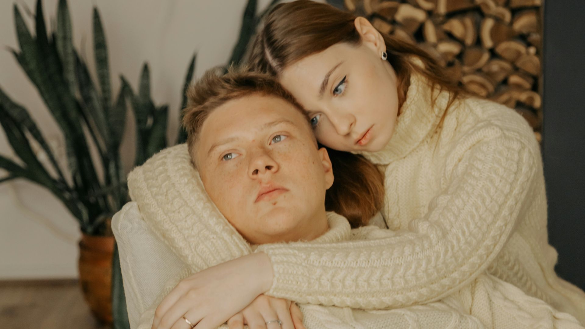 a man and a woman laying on a couch