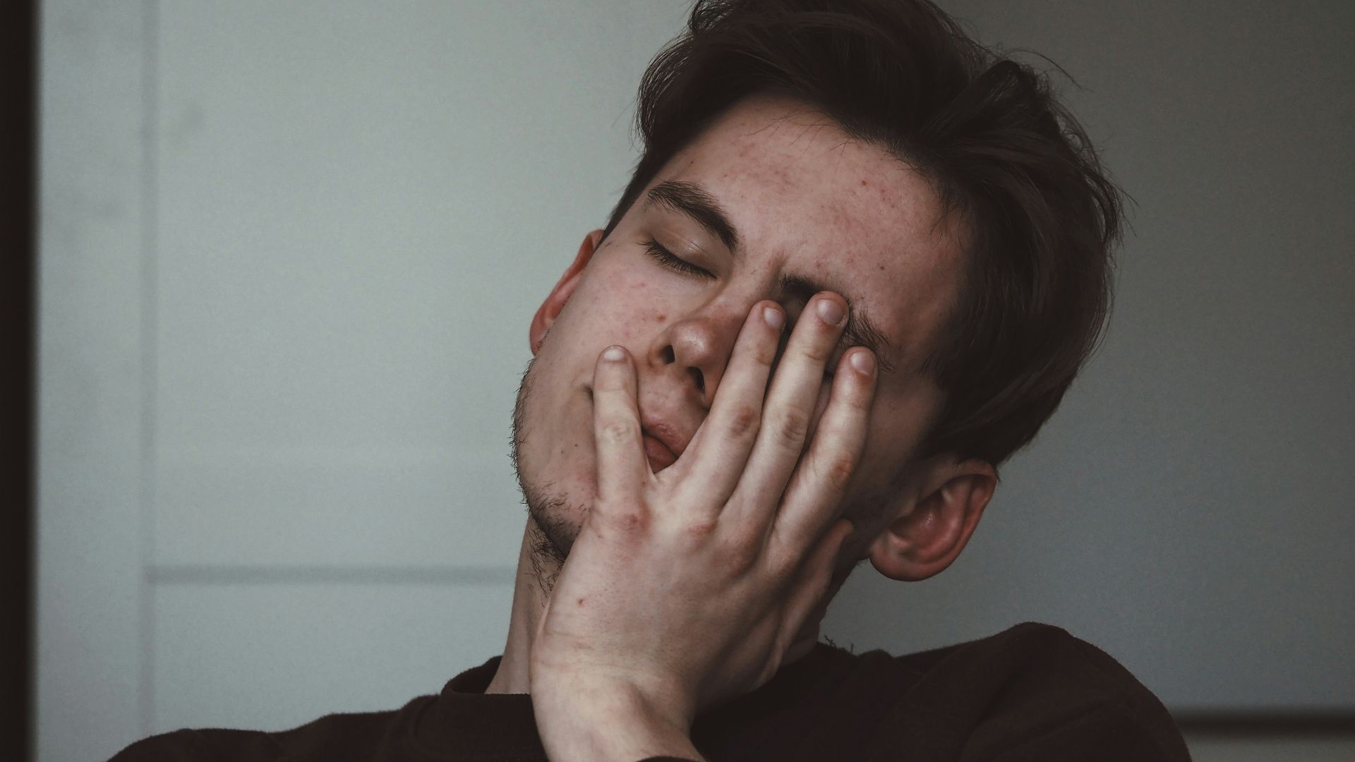 man wearing black crew-neck top