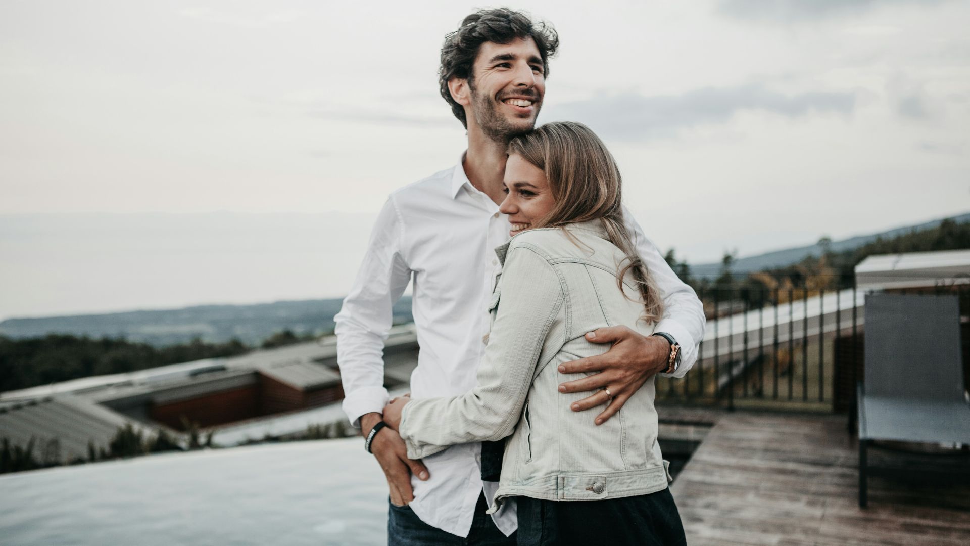 man and woman hugging each other
