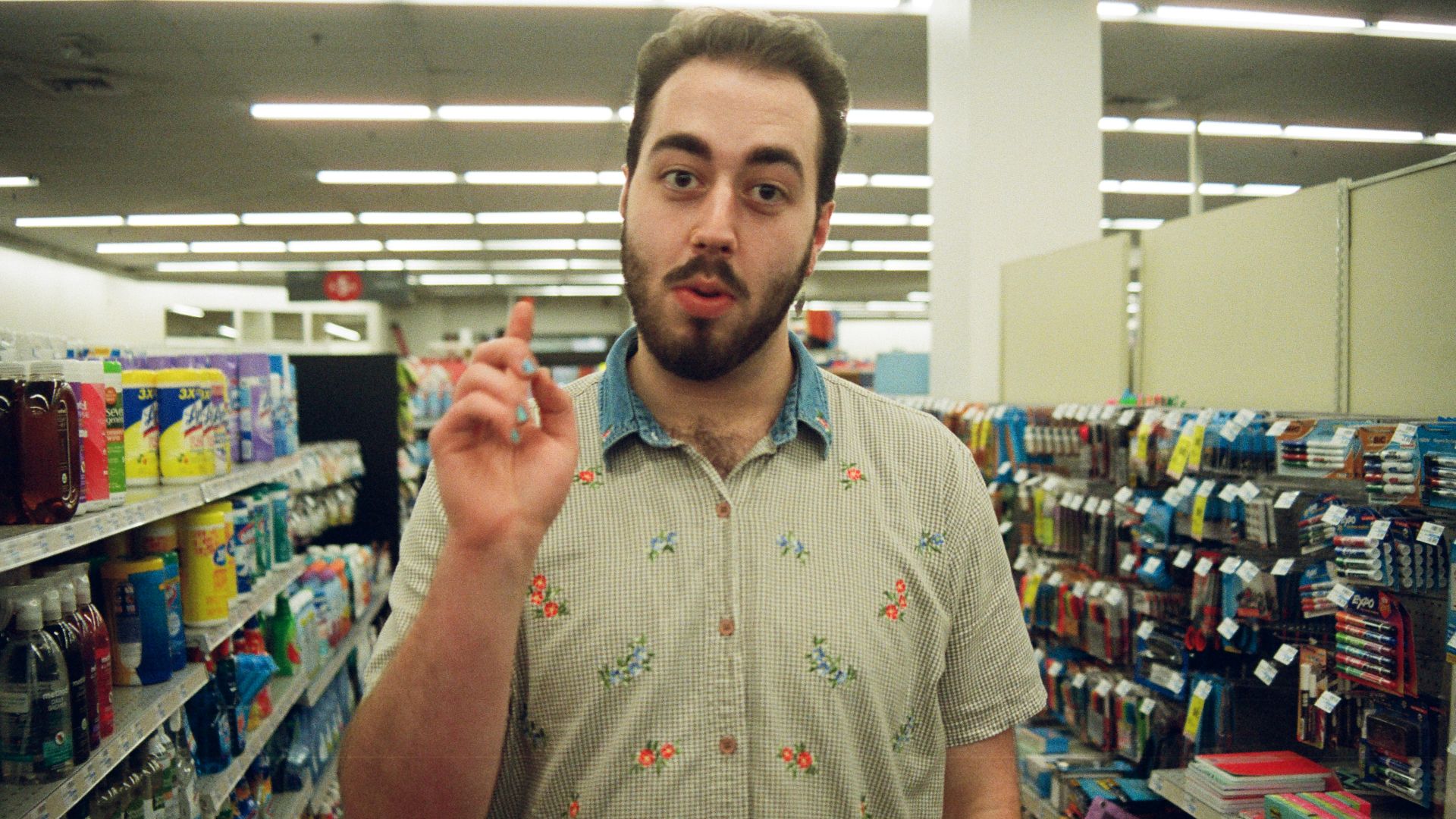 man wearing teal and gray polo shirt