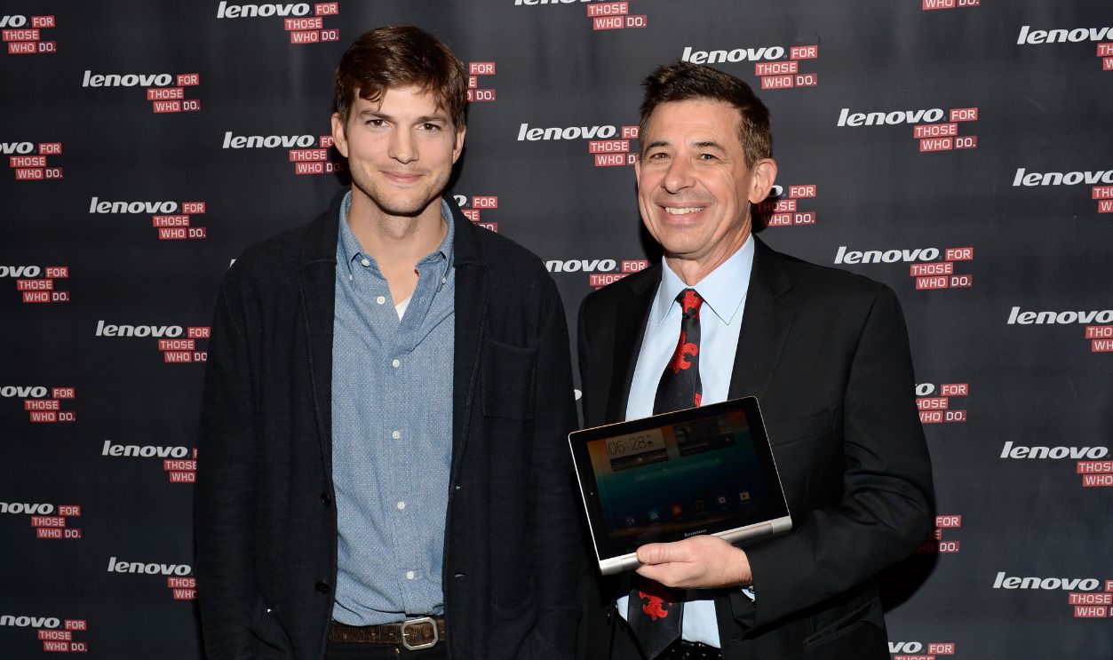 Actor Ashton Kutcher and David Roman, Senior Vice President and Chief Marketing Officer present the Yoga Tablet at YouTube Space LA on October 29, 2013 in Los Angeles, California.