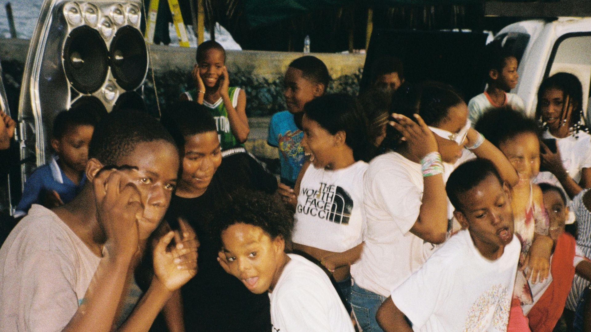 A group of people standing around each other