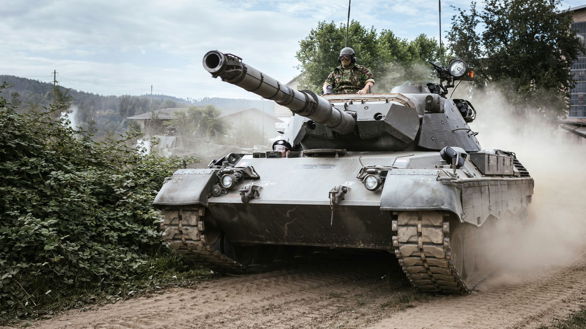 battle tank on green grass field during daytime