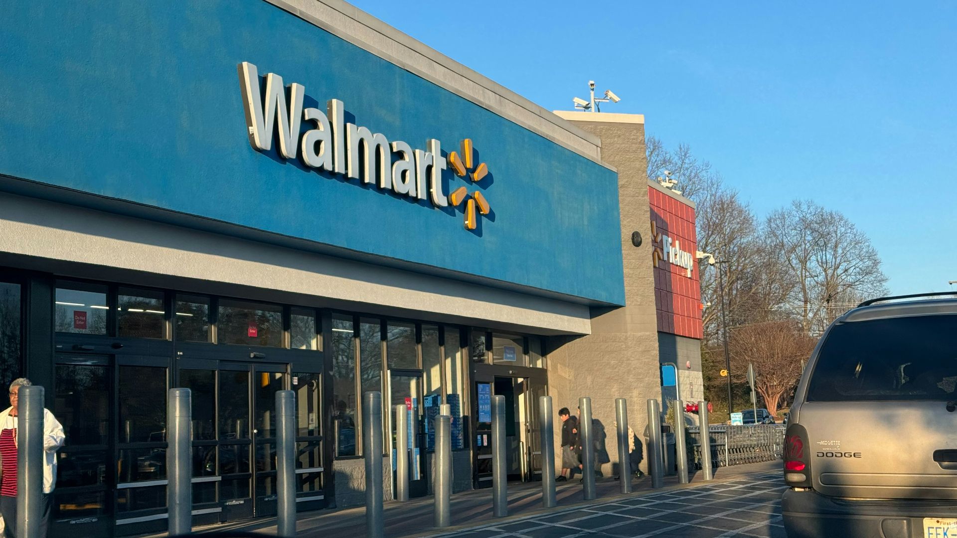 a walmart store with a car parked in front of it
