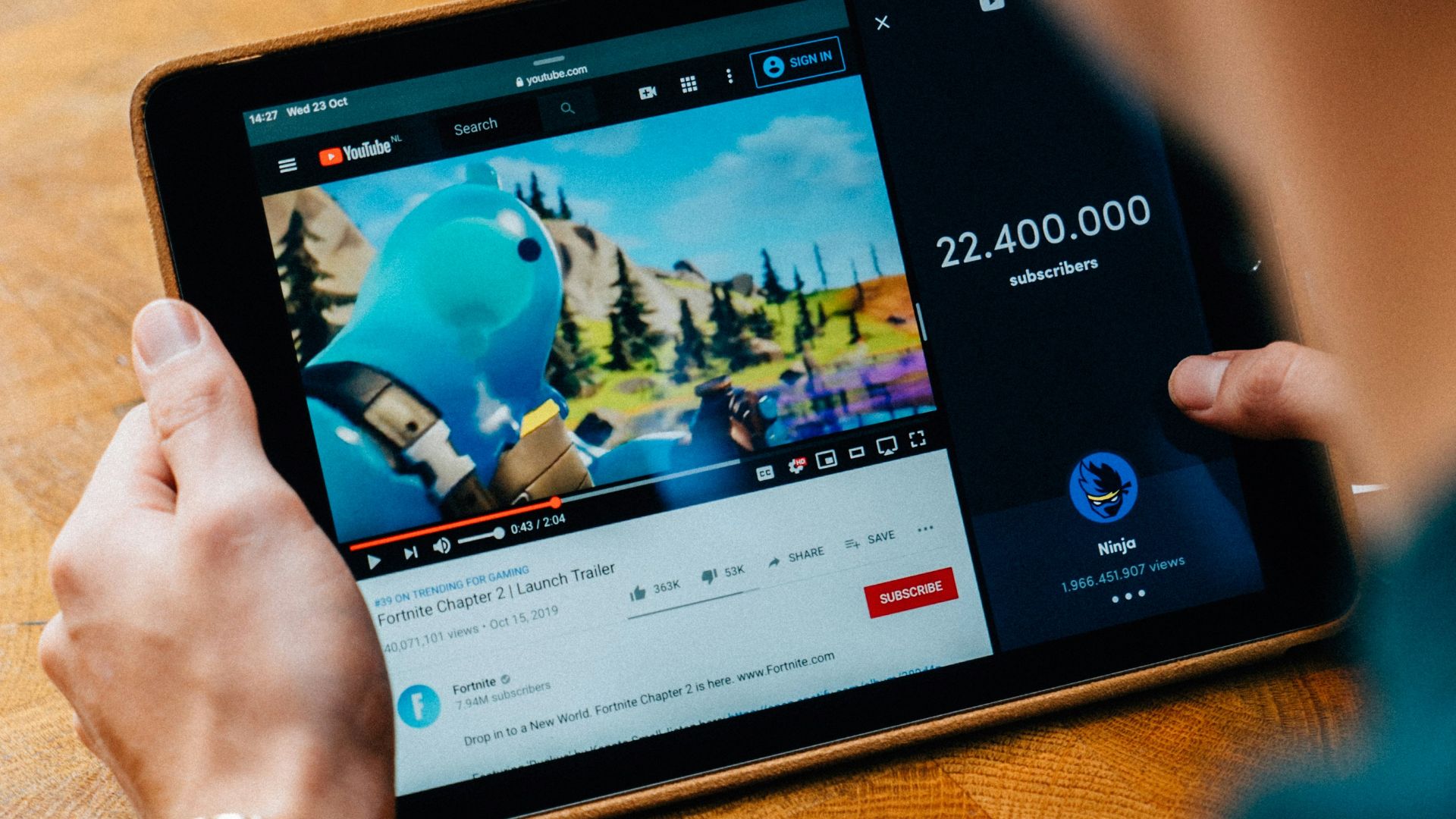 selective focus photography of person using tablet computer